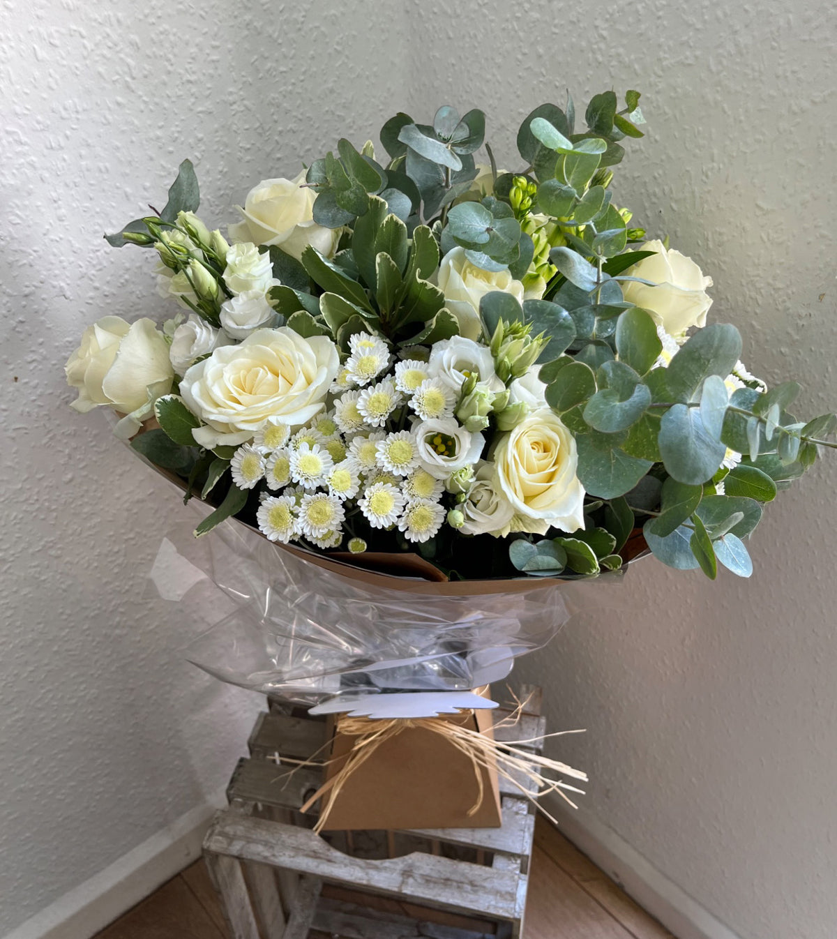 Old Money Bouquet — ivory roses, white lisianthus, chrysanthemums and eucalyptus wrapped in kraft paper